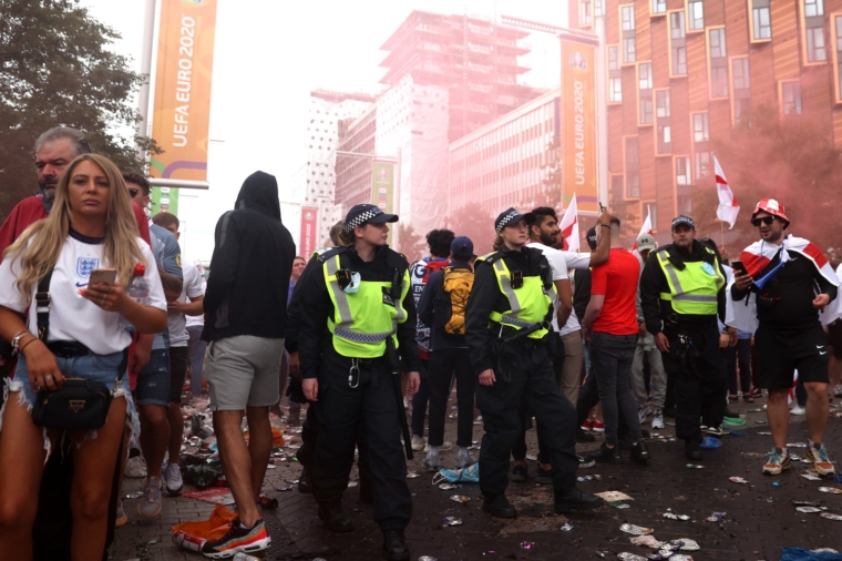 Police walk down Wembley Way during the Uefa Euro 2020 Championship Final between Italy and England at Wembley Stadium on 11 July, 2021 (Photo: Alex Pantling/Getty Images)