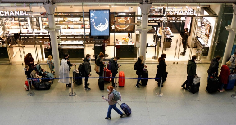 Passengers queue to board Eurostar trains at St Pancras International station in London on December 17, 2021, the final day before new restrictions are imposed on travelers to combat the spread of the Omicron variant. - France has announced that from Saturday the obligation to justify "compelling reasons" for travel from and to the United Kingdom, with the approach of the end-of-year holidays, because of the Omicron variant, which is developing at high speed in the UK. (Photo by Tolga Akmen / AFP) (Photo by TOLGA AKMEN/AFP via Getty Images)