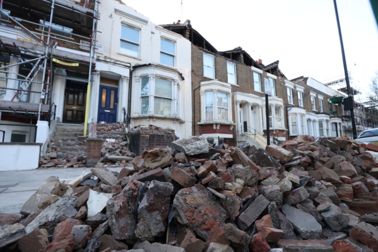 A roadside filled with debris from the rooftops of three houses which were torn off during storm Eunice, on Kilburn Park Road in north west London. Picture date: Friday February 18, 2022. PA Photo. A big clean-up is set to begin after Storm Eunice brought damage, disruption and record-breaking gusts of wind to the UK and Ireland, leading to the deaths of at least four people. Picture date: Saturday February 19, 2022. PA Photo. See PA story WEATHER Storms. Photo credit should read: James Manning/PA Wire