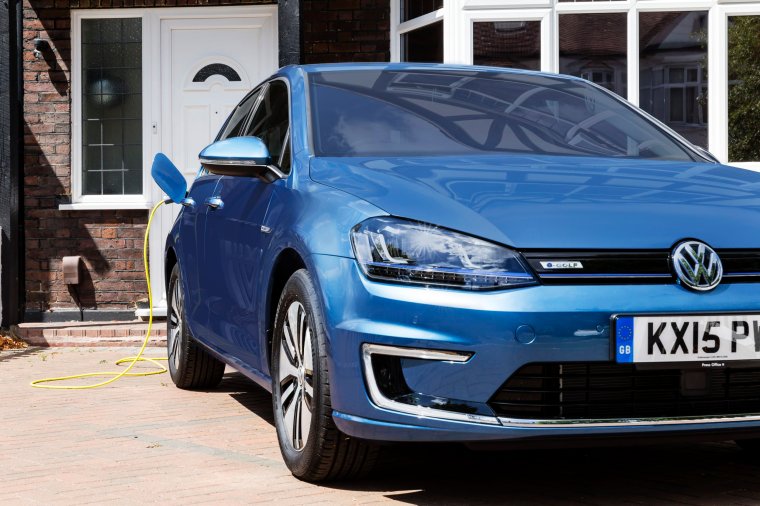 LONDON, UNITED KINGDOM - JULY 21: Go Ultra Low Volkswagen e-Golf on charge on a London driveway on July 21, 2015 in London, England. Ultra-low emission vehicles such as this can cost as little as 2p per mile to run and some electric cars and vans have a range of up to 700 miles. (Photo by Miles Willis/Getty Images for Go Ultra Low)