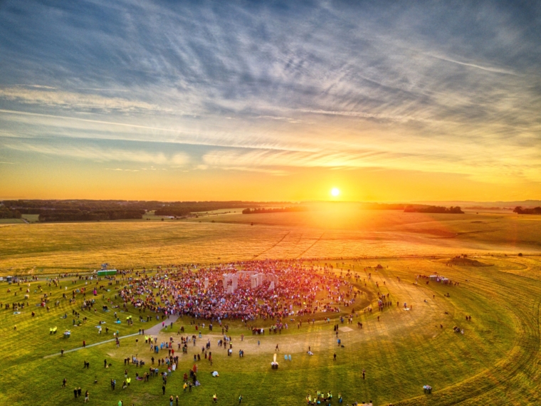 AMESBURY, UNITED KINGDOM - JUNE 21: (EDITORS NOTE: This image was processed using digital filters) The summer solstice sun breaks through the stones at Stonehenge as observed by thousands of revellers on June 21, 2019 in Amesbury, United Kingdom. (Photo by Chris Gorman/Getty Images)