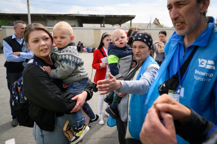 Ukrainians wait to board a coach destined for Przemysl in Poland, carrying refugees from regions of Southern and Eastern Ukraine (Photo: Leon Neal/Getty Images)