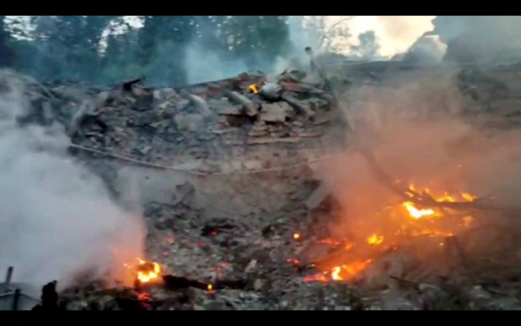 Burning debris is seen, after a school building was hit by shelling, in the village of Bilohorivka, Luhansk, Ukraine, May 8, 2022. Luhansk Regional Military-Civil Administration/Handout via REUTERS ATTENTION EDITORS - THIS IMAGE HAS BEEN PROVIDED BY A THIRD PARTY. NO RESALES. NO ARCHIVES