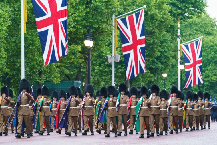 Troops carrying flags of Commonwealth nations march on The Mall, during an early morning rehearsal as service personnel from the Royal Navy, British Army, and Royal Air Force conduct a final early morning rehearsal through London ahead of Sunday's Platinum Jubilee Pageant, which will mark the finale of the Platinum Jubilee Weekend. Picture date: Tuesday May 31, 2022. PA Photo. See PA story ROYAL Jubilee. Photo credit should read: Dominic Lipinski/PA Wire