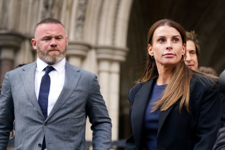 Wayne and Coleen Rooney leave the Royal Courts Of Justice, London, as the high-profile libel battle between Rebekah Vardy and Coleen Rooney finally goes to trial. Picture date: Tuesday May 10, 2022. PA Photo. Rooney accused Vardy of leaking "false stories" about her private life in October 2019 after carrying out a months-long "sting operation" which saw her dubbed "Wagatha Christie". Mrs Vardy denies the allegations and has sued the fellow footballer's wife for damages for libel over the "untrue and unjustified defamatory attack". See PA story COURTS Wagatha . Photo credit should read: Victoria Jones/PA Wire