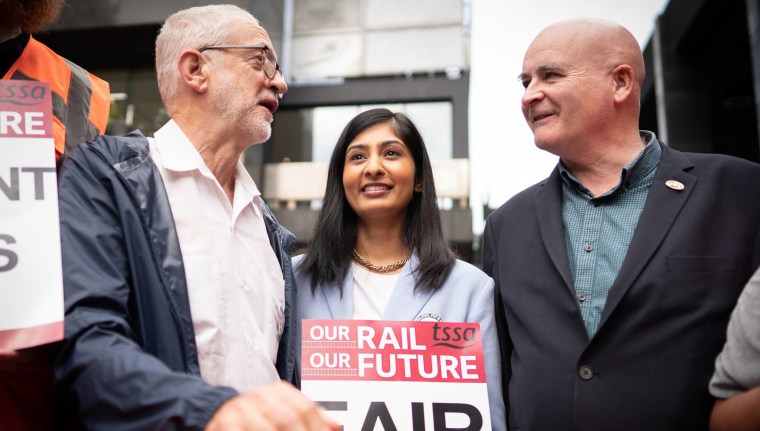 Jeremy Corbyn (left), Zarah Sultana, MP for Coventry South and Mick Lynch, General Secretary of the Rail, Maritime and Transport union (RMT) (right) on the picket line outside London Euston train station. Picture date: Thursday August 18, 2022. PA Photo. Rail services are set to be severely disrupted as members of the Transport Salaried Staffs Association (TSSA) and the Rail, Maritime and Transport (RMT) union strike in a continuing row over pay, jobs and conditions. See PA story INDUSTRY Rail. Photo credit should read: Stefan Rousseau/PA Wire