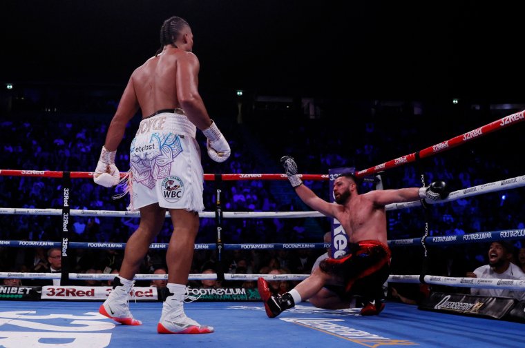 Boxing - Joe Joyce v Joseph Parker - WBO Interim World Heavyweight Title - AO Arena, Manchester, Britain- September 24, 2022 Joe Joyce knocks down Joseph Parker Action Images via Reuters/Andrew Couldridge