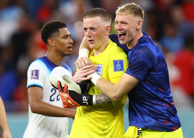 Soccer Football - FIFA World Cup Qatar 2022 - Group B - Wales v England - Ahmad Bin Ali Stadium, Al Rayyan, Qatar - November 29, 2022 England's Jordan Pickford and Aaron Ramsdale celebrate after the match REUTERS/Hannah Mckay