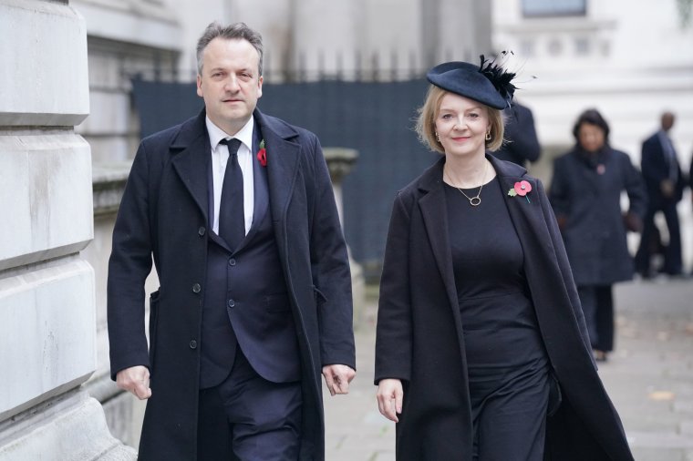 Former prime minister Liz Truss and her husband Hugh O'Leary in Downing Street, London, ahead of the Remembrance Sunday service at the Cenotaph, in Whitehall, London. Picture date: Sunday November 13, 2022. PA Photo. See PA story MEMORIAL Remembrance. Photo credit should read: Jonathan Brady/PA Wire