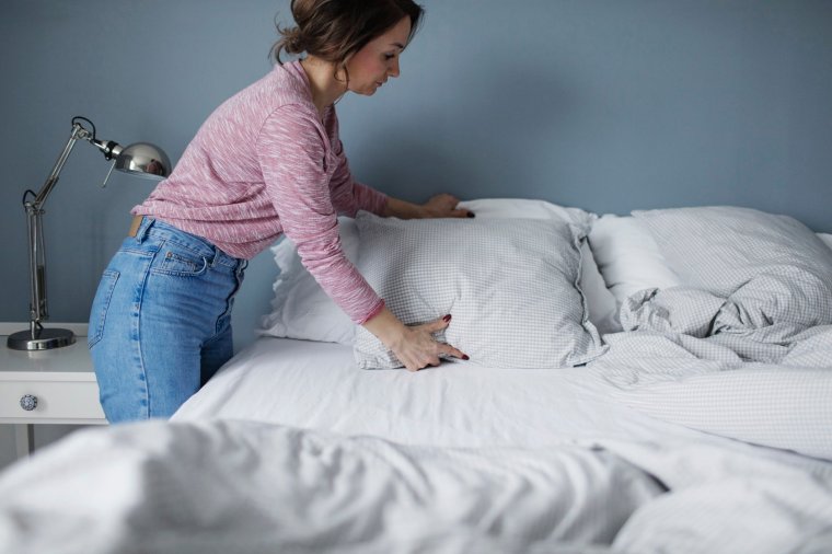 Dust mites thrive on a warm home and plenty of dead skin cells to feed on, so pillows are ideas (Photo: Maskot/Getty)