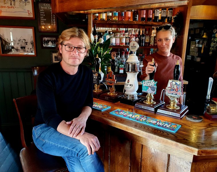 Jamie Langrish sits on a stool in front of the bar at one of his pubs (Photo: Jamie Langrish)