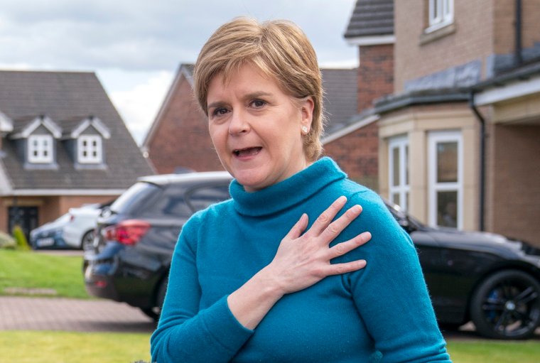 Former leader of the Scottish National Party (SNP) Nicola Sturgeon speaking to the media outside her home in Uddingston, Glasgow, after her husband, former chief executive of the SNP Peter Murrell, was "released without charge pending further investigation", after he was arrested on Wednesday as part of a probe into the party's finances. Picture date: Saturday April 8, 2023. PA Photo. See PA story POLITICS SNP. Photo credit should read: Jane Barlow/PA Wire