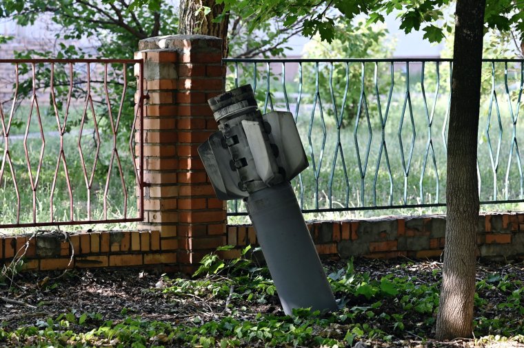 TOPSHOT - A photograph taken on July 3, 2022 shows an tail section of a 300mm rocket which appear to contained cluster bombs launched from a BM-30 Smerch multiple rocket launcher embedded in the ground after shelling in Kramatorsk, amid the Russian invasion of Ukraine. (Photo by Genya SAVILOV / AFP) / The erroneous mention[s] appearing in the metadata of this photo by Genya SAVILOV has been modified in AFP systems in the following manner: [REMOVING "UNEXPLODED" IN CAPTION]. Please immediately remove the erroneous mention[s] from all your online services and delete it (them) from your servers. If you have been authorized by AFP to distribute it (them) to third parties, please ensure that the same actions are carried out by them. Failure to promptly comply with these instructions will entail liability on your part for any continued or post notification usage. Therefore we thank you very much for all your attention and prompt action. We are sorry for the inconvenience this notification may cause and remain at your disposal for any further information you may require. (Photo by GENYA SAVILOV/AFP via Getty Images)