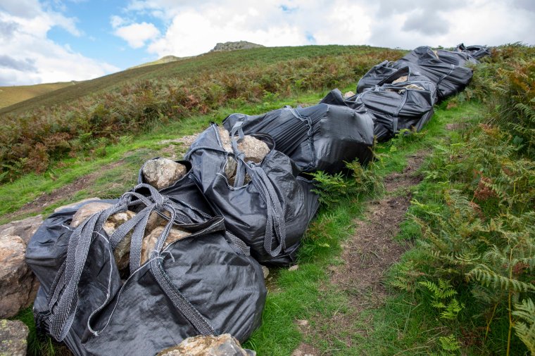 16/08/23 Grasmere , Cumbria - National Trust staff repair the footpath tothe fell Stone Arthur in The Lake District