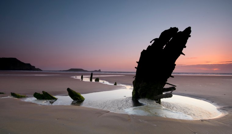 Sunset on Rhossili bay on the Gower Peninsular.