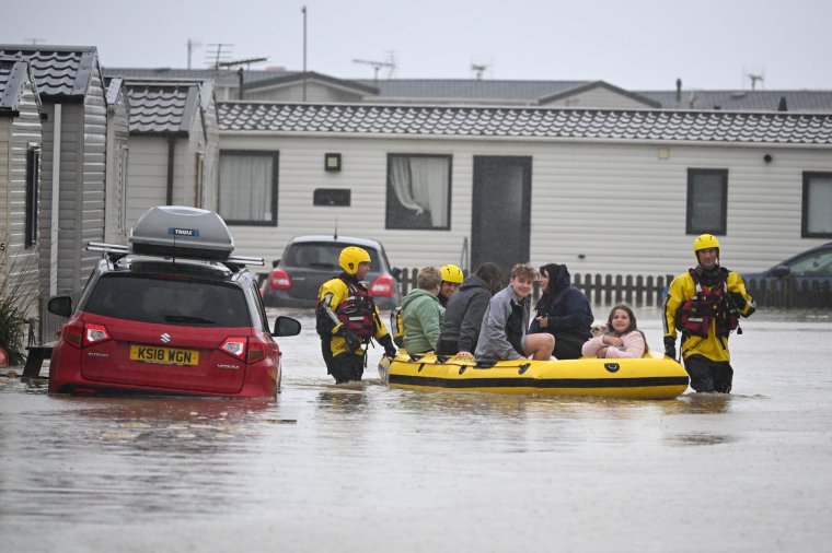 BURTON BRADSTOCK, DORSET - NOVEMBER 02: People are rescued from their holiday chalets by fire and rescue at Freshwater Beach Holiday Park, on November 02, 2023 in Burton Bradstock, Dorset. Storm Ciaran swept across the southwest and south of England overnight posing a formidable threat in certain areas such as Jersey, where winds exceeded 100 mph overnight. This, along with the already-soaked ground from Storm Babet, increases the risk of flooding in already vulnerable areas. (Photo by Finnbarr Webster/Getty Images)