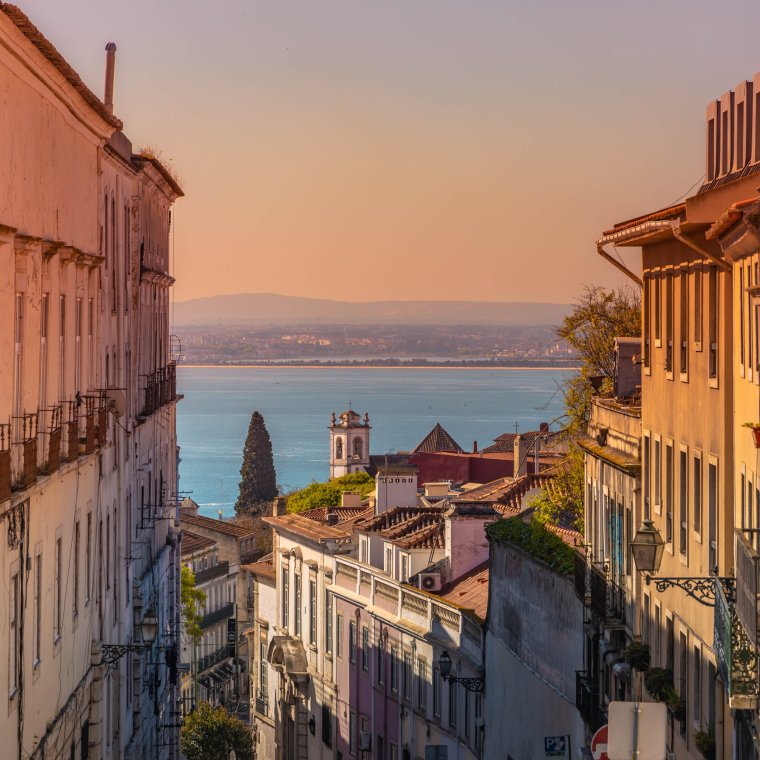 Fantasy picture of the Lisbon city with sunset sky and lonely cloud with beautiful light edition.