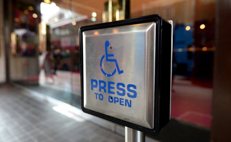 Undated file photo of a disabled entrance door button. Efforts by Government to engage with disabled people are seen as superficial as groups feel excluded from having meaningful input into policies which affect them, a report has warned. The Women and Equalities Committee urged the Government to work with disabled people to develop the national disability strategy into a 10-year plan. PA Photo. Issue date: Wednesday December 6, 2023. See PA story POLITICS Disability. Photo credit should read: Andrew Matthews/PA Wire