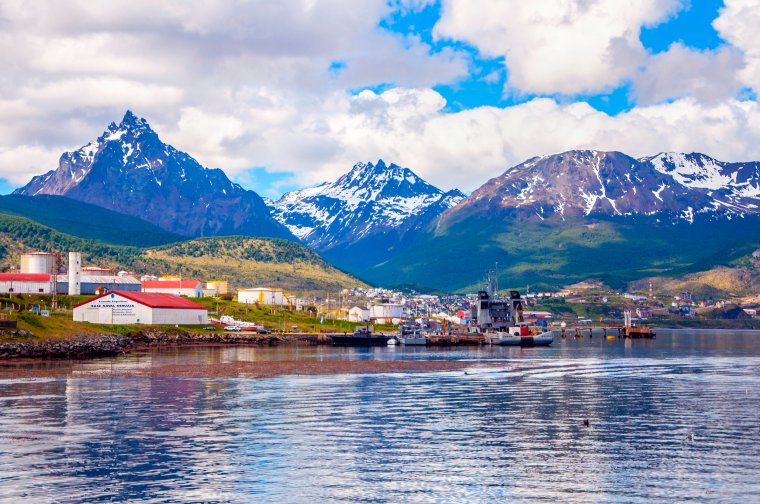 Ushuaia, Tierra del Fuego, Argentina ("The end of the world"). Panoramic view of the city, its houses, the sea and the snow-capped mountains.