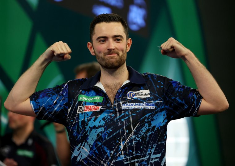 LONDON, ENGLAND - JANUARY 02: Luke Humphries of England celebrates winning his semi final match against Scott Williams of England on day 15 of the 2023/24 Paddy Power World Darts Championship at Alexandra Palace on January 02, 2024 in London, England. (Photo by Tom Dulat/Getty Images)