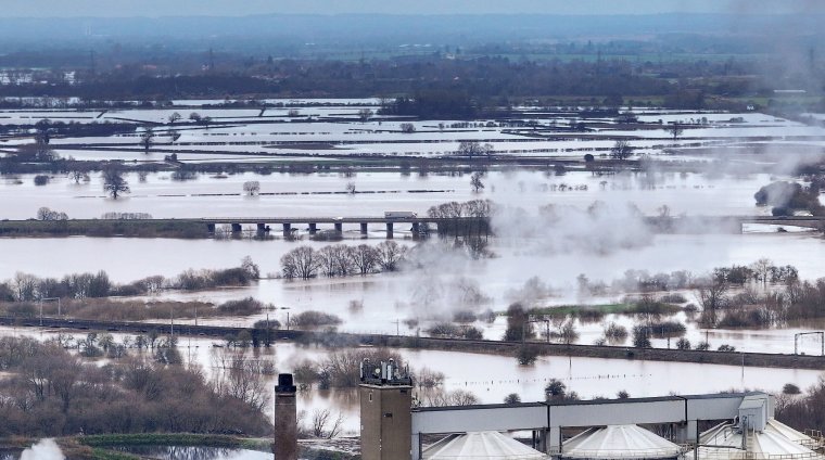 NEWARK ON TRENT, UNITED KINGDOM - JANUARY 05: In this aerial view in the aftermath of Storm Henk, fields and roads are flooded after the River Trent burst its banks with a major incident declared in Nottinghamshire on January 05, 2024 in Newark On Trent, United Kingdom. Days of heavy rainfall have exacerbated conditions in already saturated areas in the wake of Storm Henk, which caused widespread damage across parts of the UK, with winds of more than 90mph sweeping across some regions. (Photo by Christopher Furlong/Getty Images)