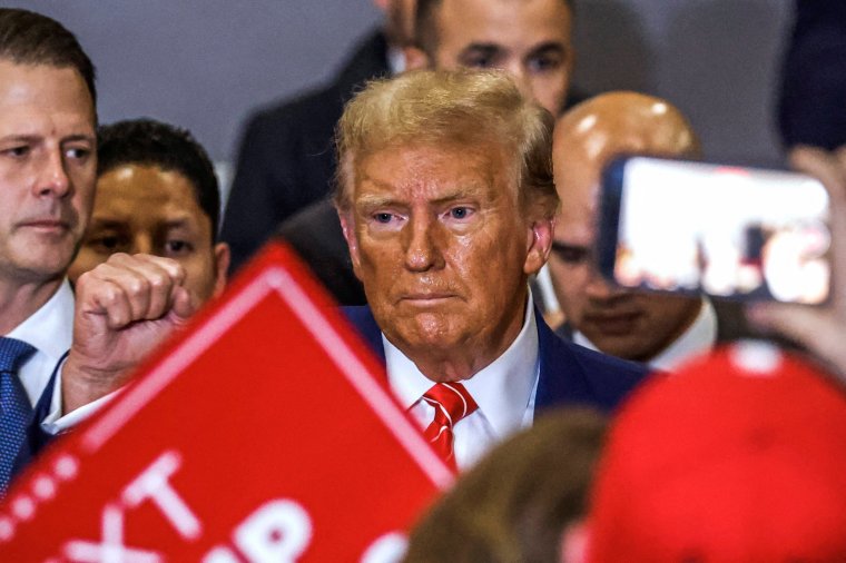 Former US President and Republican presidential hopeful Donald Trump departs after speaking at a "Commit to Caucus" rally in Clinton, Iowa, on January 6, 2024. (Photo by TANNEN MAURY / AFP) (Photo by TANNEN MAURY/AFP via Getty Images)