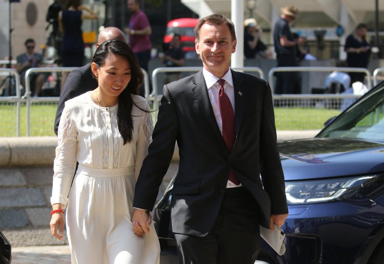 Jeremy Hunt and his wife Lucia (left) hosted the winning bidders from the school auction for ‘traditional English tea’ at the House of Commons (Photo Isabel Infantes/AFP via Getty Images) 