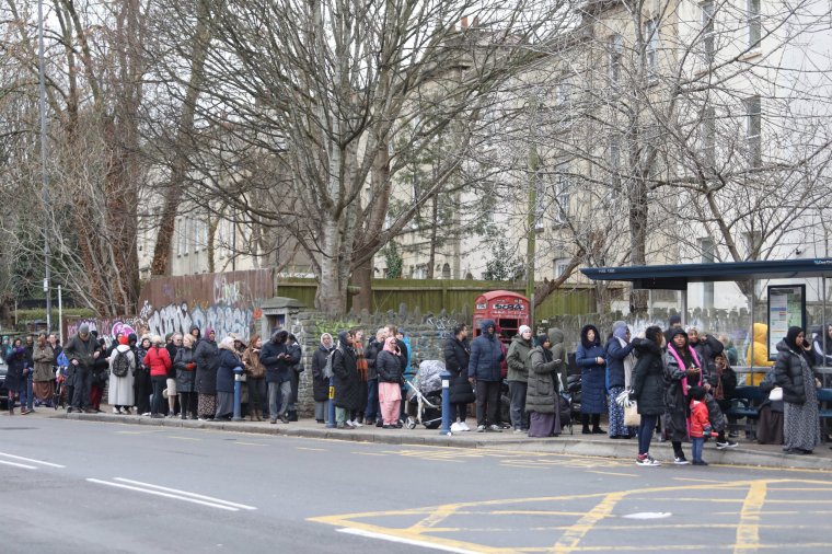 A huge queue outside Saint Pauls Dental Practice where people hope to register for NHS dental care. Bristol. February 5 2024. See SWNS story SWLNdentist. Hundreds of people have joined a queue outside a new dental practice in the hope of getting NHS dental care.Saint Pauls Dental Practice in Bristol opened today under new management and was previously known as Bupa Dental Practice.The long line along Ashley Court began forming early in the morning as locals tried to get NHS treatment.Police were called to manage the massive crowd which has been called "absurd" by one local woman.