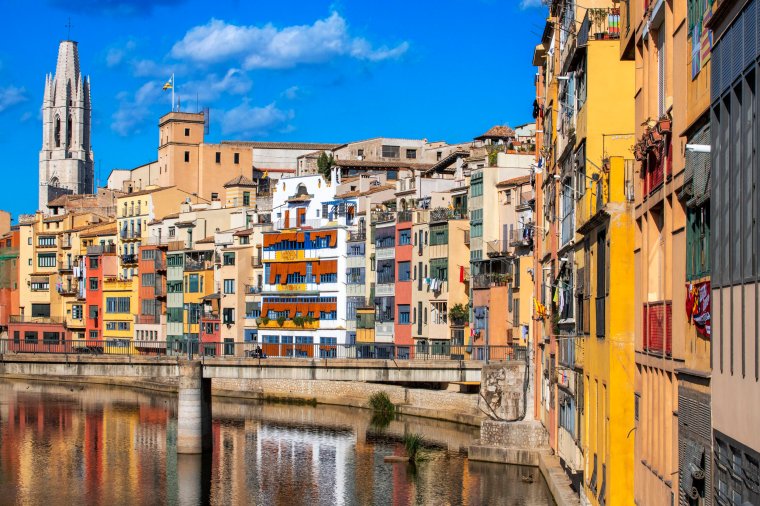 Cathedral and colorful houses on the side of river Onyar in the evening, Girona, Catalonia, Spain. (Photo by: Sergi Reboredo/VW Pics/Universal Images Group via Getty Images)