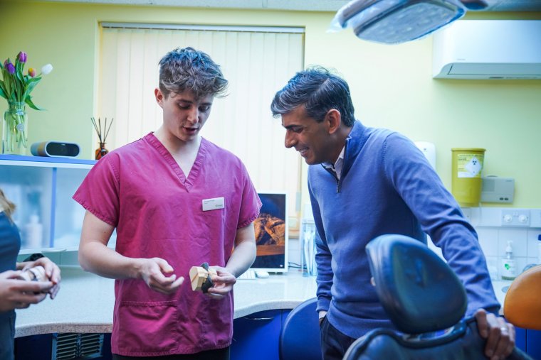 NEWQUAY, ENGLAND - FEBRUARY 08: British Prime Minister Rishi Sunak meets patients and staff on a visit to the Gentle Dental practice on February 08, 2024 in Newquay, Cornwall, England. Sunak announces an extra ??200 million of government funding to encourage NHS dentists to treat a million new patients who haven't seen a dentist in two years or more. (Photo by Hugh Hastings/Getty Images)