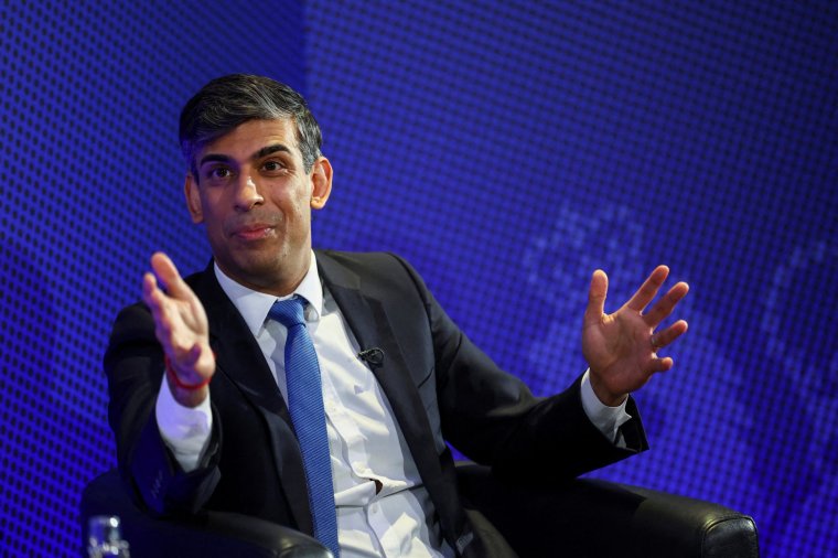 Britain's Prime Minister Rishi Sunak gestures during a press conference during a visit to the apprentice training centre of the Manufacturing Technology Centre (MTC), in Coventry, central England, on March 18, 2024. (Photo by Carl Recine / POOL / AFP) (Photo by CARL RECINE/POOL/AFP via Getty Images)