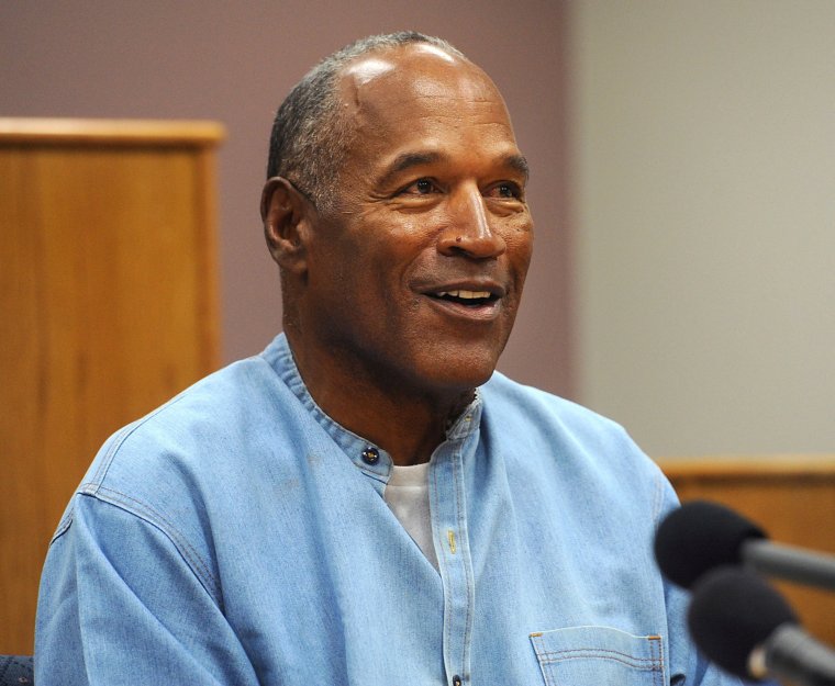 FILE PHOTO: O.J. Simpson reacts during his parole hearing at Lovelock Correctional Center in Lovelock, Nevada, U.S., July 20, 2017. REUTERS/Jason Bean/Pool/File Photo