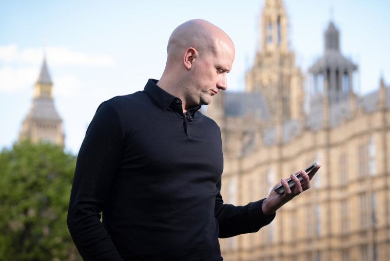 SNP Westminster leader Stephen Flynn checks his phone during an interview with the media on College Green, London, outside the the Palace of Westminster, following the announcement that Humza Yousaf will resign as SNP leader and Scotland's First Minister, avoiding having to face a no confidence vote in his leadership. Picture date: Monday April 29, 2024. PA Photo. See PA story POLITICS Yousaf. Photo credit should read: Stefan Rousseau/PA Wire