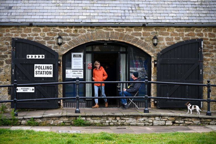 WEST BAY, ENGLAND - MAY 02: A person leaves the polling station at The Salt House, on May 02, 2024 in West Bay, England. Polls have opened across 107 authorities in England where voters are set to determine the fate of nearly 2,700 council seats. (Photo by Finnbarr Webster/Getty Images)