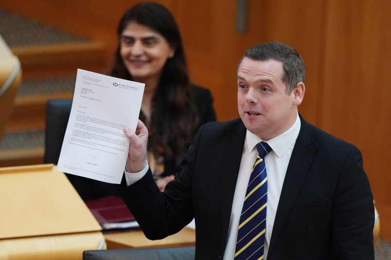 Scottish Conservative leader Douglas Ross holds up a letter written to him by First Minister Humza Yousaf during First Minster's Questions (FMQ's) at the Scottish Parliament in Holyrood, Edinburgh. Yousaf announced his resignation as the country's First Minister on Monday. Picture date: Thursday May 2, 2024. PA Photo. See PA story POLITICS SNP. Photo credit should read: Andrew Milligan/PA Wire