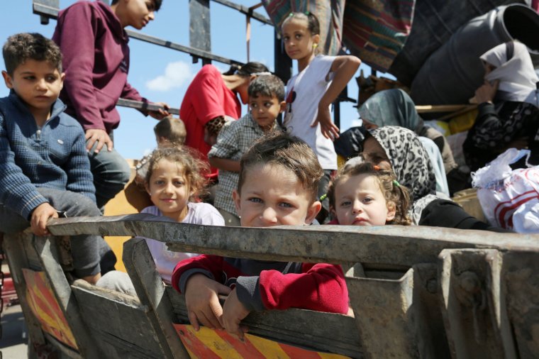 RAFAH, GAZA - MAY 07: Hundreds of Palestinians from the east of Rafah hit the road to the coastline of Deir Al Balah after the Israeli army announced that it has taken control of the Palestinian side of the Rafah border crossing, in Deir Al Balah, Gaza Strip on May 07, 2024. (Photo by Ashraf Amra/Anadolu via Getty Images)