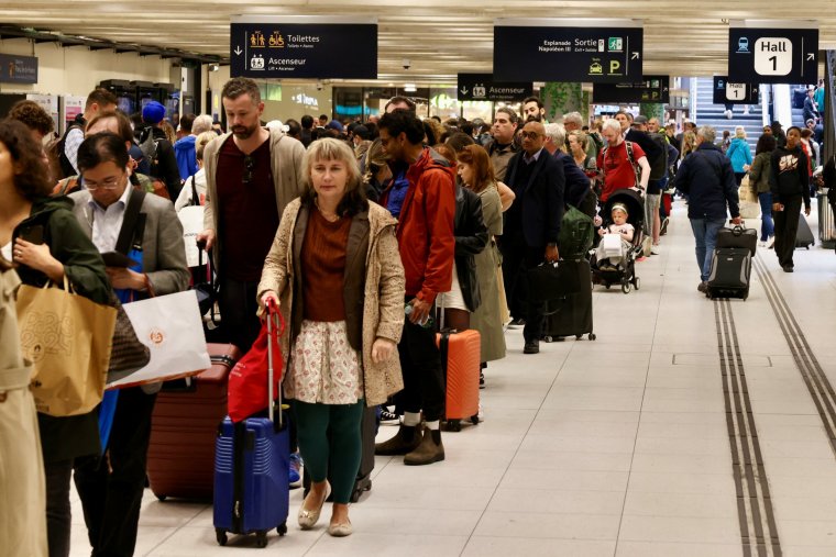 People queue at the Gare du Nord as Eurostar trains were delayed by a British e-gate failure in Paris, France, May 30, 2024. REUTERS/Kevin Coombs