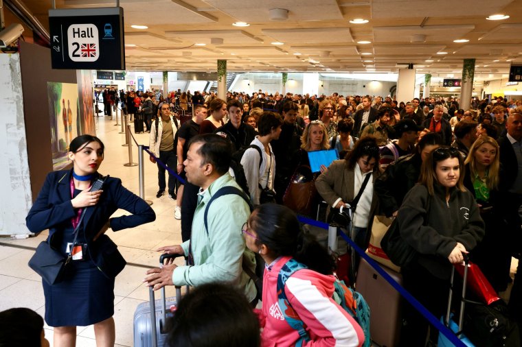 People queue at the Gare du Nord as Eurostar trains were delayed by a British e-gate failure in Paris, France, May 30, 2024. REUTERS/Kevin Coombs