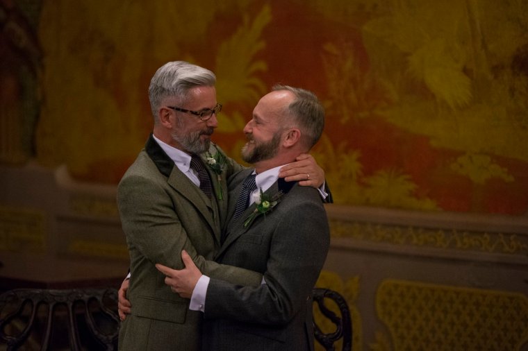 BRIGHTON, UNITED KINGDOM - MARCH 29: Gay couple Neil Allard (R) and Andrew Wale are married in the Music Room of Brighton's Royal Pavilion shortly after midnight in one of the UK's first same-sex weddings on March 29, 2014 in Brighton, England. Same sex couples have been able to enter into 'civil partnerships' since 2005, however following a change in the law in July 2013 gay couples are now eligible to marry in England and Wales. A number of gay couples have arranged for their wedding ceremonies to take place shortly after midnight on March 29, 2014 to become some of the first to take advantage of the new law. Parliament's decision to grant same sex couples an equal right to marriage has been met with opposition from religious groups. Gay marriage is currently being debated in Scotland, however the Northern Ireland administration has no plans to make it law. (Photo by Oli Scarff/Getty Images)