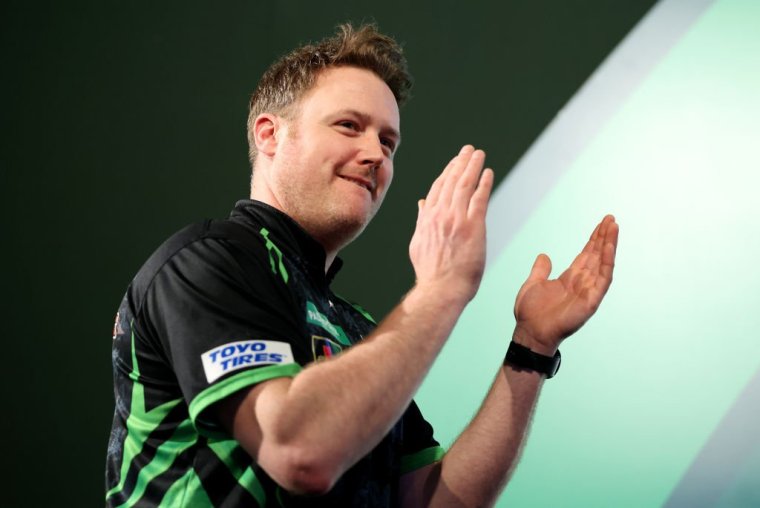 LONDON, ENGLAND - DECEMBER 29: Jim Williams of Wales smiles during his round three match against Raymond van Barneveld of Netherlands on day 12 of the 2023/24 Paddy Power World Darts Championship at Alexandra Palace on December 29, 2023 in London, England. (Photo by Tom Dulat/Getty Images)