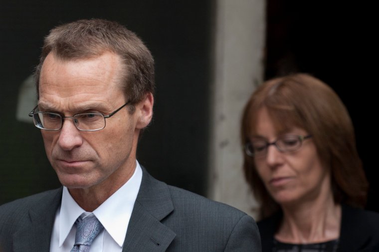 Ian (L) and Ellen (R) Williams, mother and father of British MI6 officer Gareth Williams who was found dead in inside a sports bag in his flat in 2010, leave Westminster Coroners Court in central London on May 2, 2012, after a narrative verdict was announced into the mysterious death of their son. The British spy found padlocked in a bag in his bathtub was probably unlawfully killed, the coroner Fiona Wilcox concluded on May 2 on the final day of the inquest into his death. But it is "unlikely" that the full circumstances of the death of Gareth Williams will ever be explained, she added. AFP PHOTO / STR (Photo credit should read -/AFP/GettyImages)