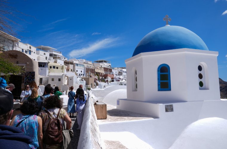 SANTORINI, GREECE - MAY 9: A general view from Santorini Island, one of the most famous islands in the world with its traditional architecture, houses made of stones unique to the region, in Santorini, Greece on May 9, 2024. The island, which attracts attention with its settlement built on the cliffs, can be reached by cable car or by climbing a 657-step stairway after travelling by sea. (Photo by Mehmet Emin Menguarslan/Anadolu via Getty Images)