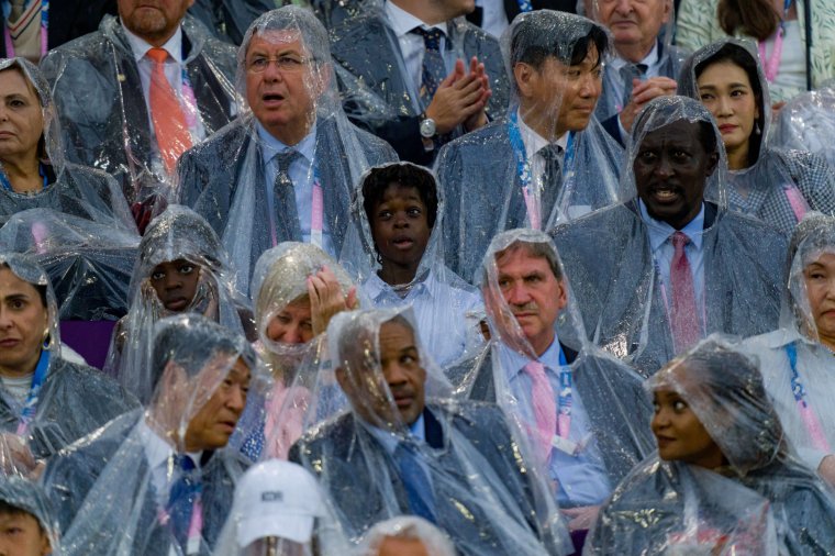 PARIS, FRANCE - JULY 26: Dignitaries and IOC delegates wear rain ponchos during the opening ceremony of the Paris 2024 Olympic Games in Paris on July 26, 2024. (Photo by Andy Cheung/Getty Images)