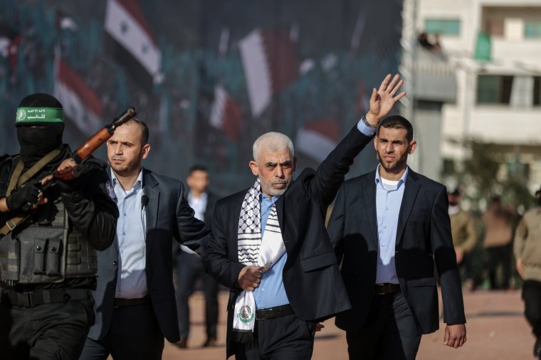 GAZA CITY, GAZA - DECEMBER 14: Yahya Sinwar (C), Palestinian leader of Hamas in Gaza Strip, greets people during an event marking the 35th anniversary of the establishment of Hamas in Gaza City, Gaza on December 14, 2022. (Photo by Ali Jadallah/Anadolu Agency via Getty Images)