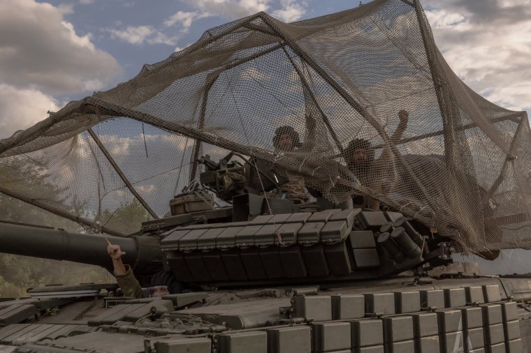 Ukrainian servicemen drive a Soviet-made T-64 tank in the Sumy region, near the border with Russia, on August 11, 2024, amid the Russian invasion of Ukraine. Russia on August 11 acknowledged Ukrainian troops had pierced deep into the Kursk border region in an offensive that a top official in Ukraine said aimed to "destabilise" Russia and "stretch" its forces. (Photo by Roman PILIPEY / AFP) (Photo by ROMAN PILIPEY/AFP via Getty Images)