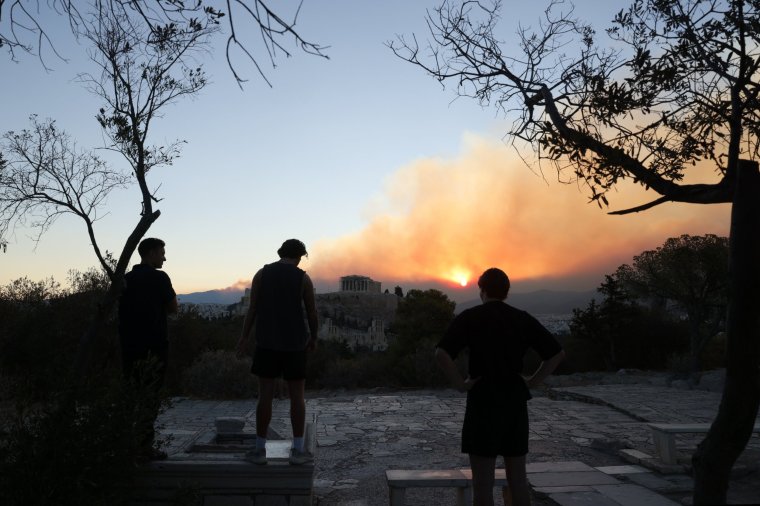 ATHENS, GREECE- AUGUST 12: Smoke rises over Parthenon temple during a wildfire near Athens, Greece, on August 12, 2024. (Photo by Costas Baltas/Anadolu via Getty Images)