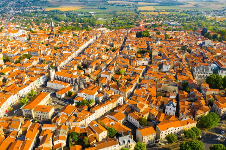 Scenic drone view of Riom summer cityscape and surroundings, Puy-de-Dome department, France