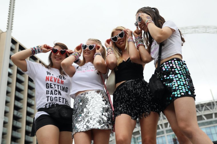 LONDON, ENGLAND - AUGUST 15: Taylor Swift fans, also known as "Swifties", arrive at Wembley Stadium ahead of her performance on August 15, 2024 in London, England. Following the cancellation of her Vienna gigs last week due to a foiled terror plot, the singer's first performance will feature heightened security measures. New rules include prohibiting 'Swifties' from gathering outside entrances, banning camping, and restricting items such as large bags, non-medical face coverings, chains, and hard plastics. (Photo by Alishia Abodunde/Getty Images) *** BESTPIX ***