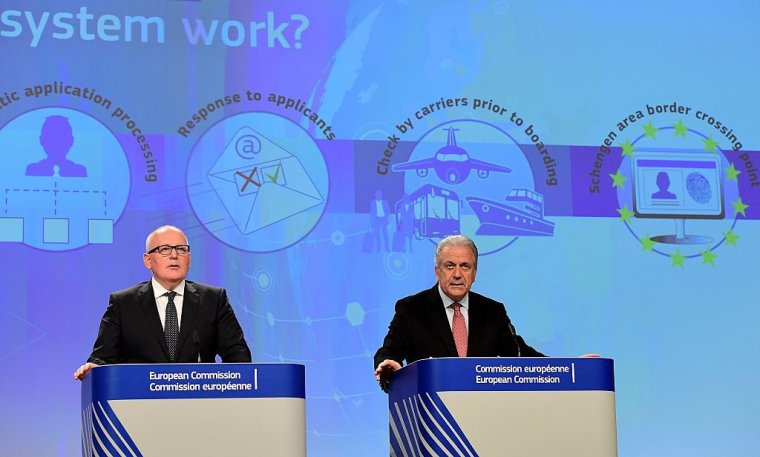 European Commission First Vice-President Timmermans (L) and European Commissioner Dimitris Avramopoulos give a press conference on progress towards a European Security Union and the proposal for a European Travel Information and Authorisation System (ETIAS) at European Commission in Brussels, on November 16, 2016. / AFP / EMMANUEL DUNAND (Photo credit should read EMMANUEL DUNAND/AFP via Getty Images)