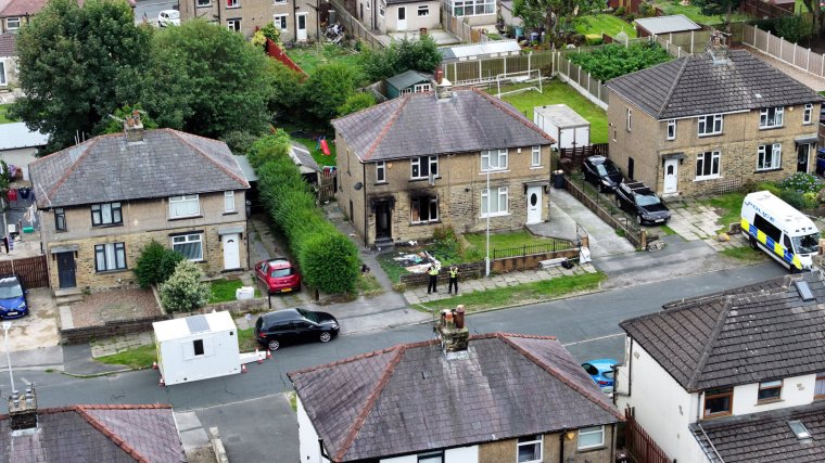 BRADFORD, ENGLAND - AUGUST 21: An aerial view of the scene in Westbury Road after a house fire killed four people on August 21, 2024 in Bradford, England. A woman and three children have died in a house fire in Bradford thought to have been started deliberately in the early hours of this morning. A man has been arrested on suspicion of murder. (Photo by Christopher Furlong/Getty Images)